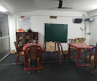Coaching classroom with seating and chalkboard